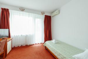 Postel nebo postele na pokoji v ubytování Hotel Rusca