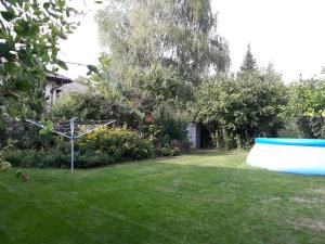 a yard with a large object in the grass at Ferienwohnung Heider in Neusiedl am See
