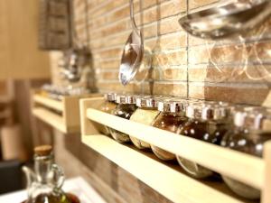 a row of bottles on a counter in a kitchen at La Caseta de Palamós in Palamós