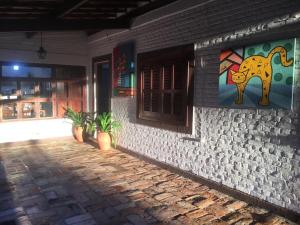 a building with an elephant painted on the side of it at Casa de Campo & Home Office - Itapecerica da Serra , perto do Embu das Artes in Itapecerica da Serra +50 photos