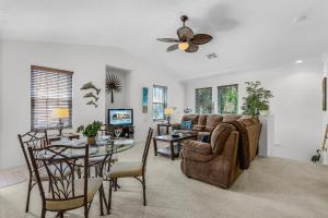 a living room with a couch and a table at Peaceful and Relaxing Community - Peace of Cape - Roelens in Cape Coral