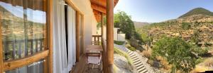 a balcony with a view of a mountain view at Bellísima cueva acogedora "Casa Olivia" in Gor