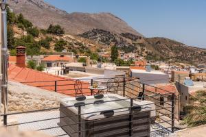 arial view of a city with mountains in the background at Athali Villa in Krousón