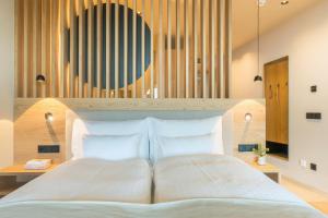 Ένα ή περισσότερα κρεβάτια σε δωμάτιο στο Hotel am Hang