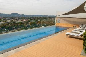 a swimming pool on the roof of a building at Triple M Luxury in Pretoria