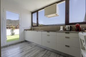 Kuchyň nebo kuchyňský kout v ubytování Terraza de Santa Cruz