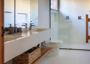 a bathroom with a sink and a toilet at Malhada Jeri in Jericoacoara