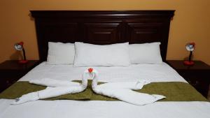 Ένα ή περισσότερα κρεβάτια σε δωμάτιο στο Apart Hotel Pico Bonito