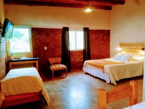 Ένα ή περισσότερα κρεβάτια σε δωμάτιο στο Cabaña AmaNacer