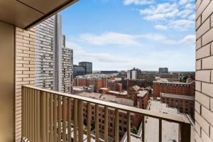 a balcony with a view of a city at The Artist Abode in Central Manchester - Parking in Manchester