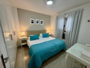 Ένα ή περισσότερα κρεβάτια σε δωμάτιο στο COSTA AZUL APARTMENTS - 2A