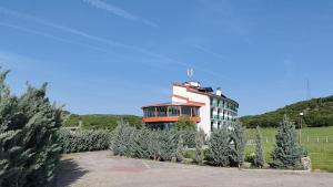 a building with trees in front of it at Lina Garden Otel in Bingol