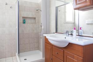 a bathroom with a sink and a shower at Salento Mare Daniela in Leuca +38 photos