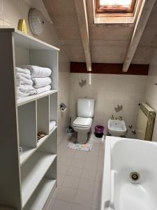 a bathroom with a toilet and a sink at Residence Armonia in Boario Terme