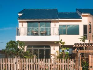 a house with a fence in front of it at 6 senses Hoi An Villa luxury 5BR 6bed and 5 minutes to An Bang beach in An Bang
