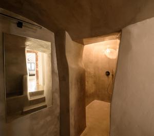 a room with a hallway with a door and a mirror at Domus Pyrgos in Pirgos