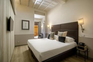 Posteľ alebo postele v izbe v ubytovaní Condotti Palace