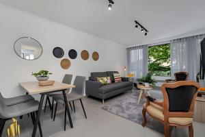 a living room with a couch and a table and chairs at Ankara 301 - Contemporary Loft Trendy in provenza in El Poblado