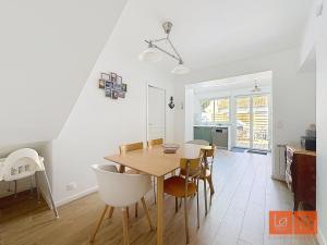 a kitchen and dining room with a table and chairs at Au Gré de la Mer in Wimille