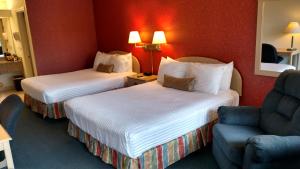 Llit o llits en una habitació de Lewis River Inn