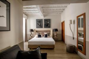 Posteľ alebo postele v izbe v ubytovaní Condotti Palace