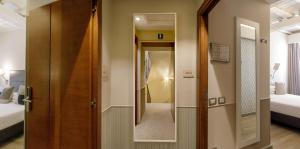 Posteľ alebo postele v izbe v ubytovaní Condotti Palace