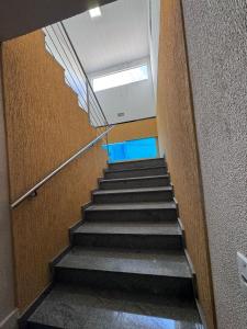 a staircase in a building with a stair case at Liv Stay in Brasília