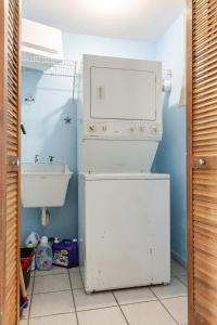a small bathroom with a sink and a toilet at Costa Brava Beach & Pool Apartment 24-402 in Ceiba