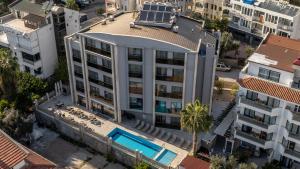 an aerial view of a building with a swimming pool at Peramis Hotel & Spa in Antalya