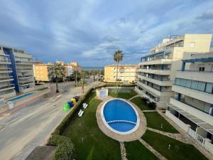 an aerial view of a building with a swimming pool at Arc Blau in Piles