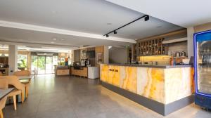 a large room with a counter and a kitchen at Peramis Hotel & Spa in Antalya