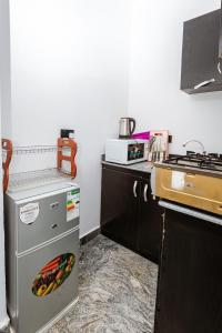 Η κουζίνα ή μικρή κουζίνα στο Oyster Shell Apartments