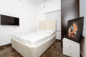 Ένα ή περισσότερα κρεβάτια σε δωμάτιο στο Oyster Shell Apartments