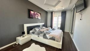 a bedroom with a large bed and a window at RIVABeach House in Lourinhã +23 photos