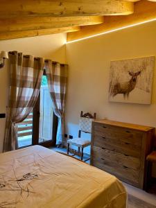 Ένα ή περισσότερα κρεβάτια σε δωμάτιο στο Méijòn Lo Brenlo