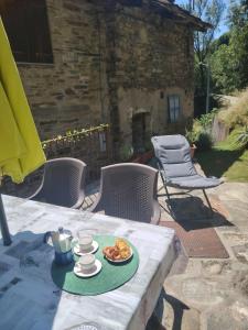 a table with a plate of food on top of it at Baita LA CANAL in Monastero di Lanzo