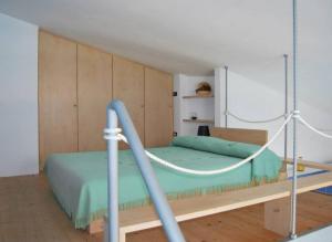 a bedroom with a bed with a swing at Casa Trama in Pisciotta