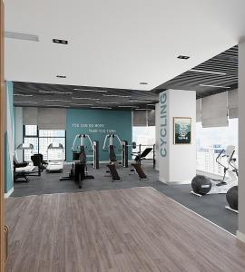 a gym with treadmills and machines in a room at Căn hộ Master có sofa giường view sông Đồng Nai in Long Bình +16 photos