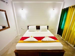 Postel nebo postele na pokoji v ubytování Otara Garden