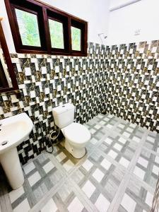 Koupelna v ubytování Otara Garden