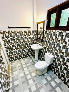 Koupelna v ubytování Otara Garden