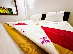 Postel nebo postele na pokoji v ubytování Otara Garden + 3 fotografie