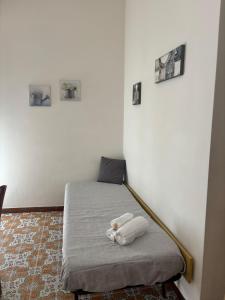 a room with a bed with a stuffed animal on it at Da Fede al mare in Moneglia +26 photos