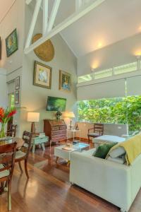 a living room with a couch and a table at Beachfront Residencia Blanca in Puerto Viejo in Puerto Viejo