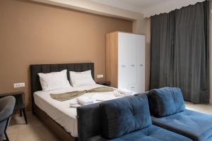 Ένα ή περισσότερα κρεβάτια σε δωμάτιο στο Perdika center rooms