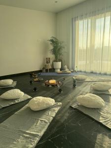 a room with pillows on the floor with a plant at Harmony Resort & Spa in Padumble +59 photos