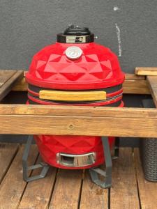 a red backpack sitting on top of a table at Harmony Resort & Spa in Padumble