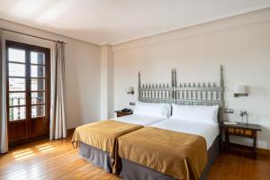 Posteľ alebo postele v izbe v ubytovaní Parador de Calahorra