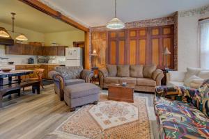 a living room with a couch and a table at Rideau lakes country home in Portland