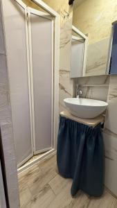a bathroom with a sink and a mirror at A due passi dal mare ,Cala paradiso in Augusta